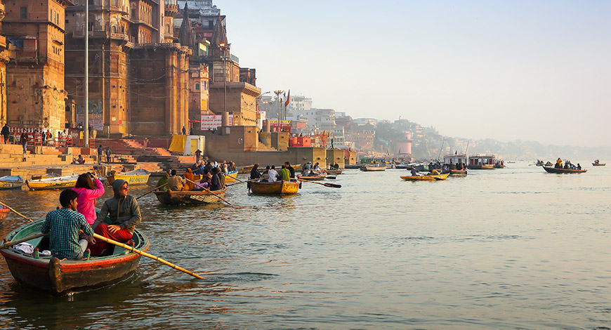Boats and devotees along the Varanasi ghats