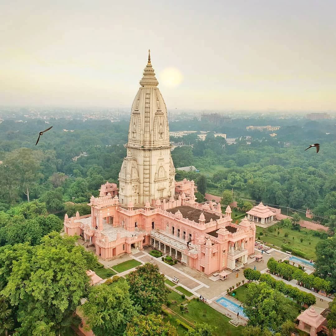 Aerial view of a Hindu temple surrounded by trees